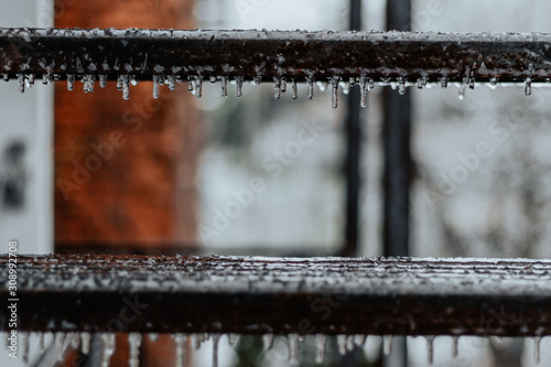 Icicles on fire escape stairs in winter