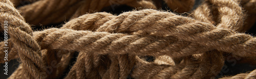 close up view of rope on black background, panoramic shot