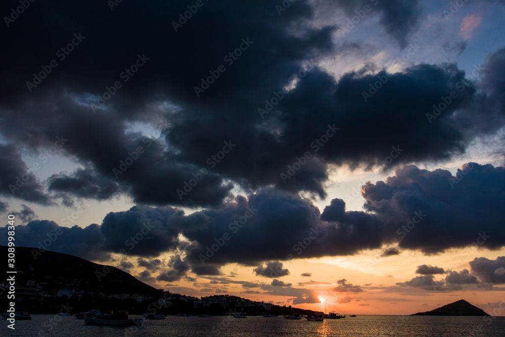 Summer morning sunrise/evening sunset over Mediterranean sea scenery in the Porto Rafti bay, Greece, Europe