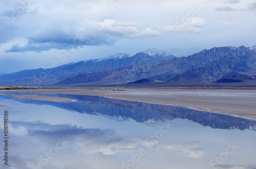 Cottonball Basin and the Panamint Mountains with reflections in calm water  Death Valley National Park  California  USA