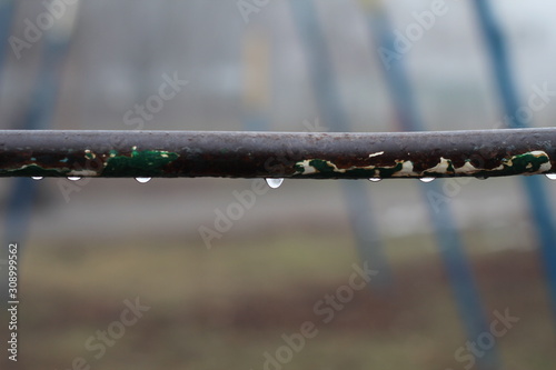A raindrop on the pipe in the winter
