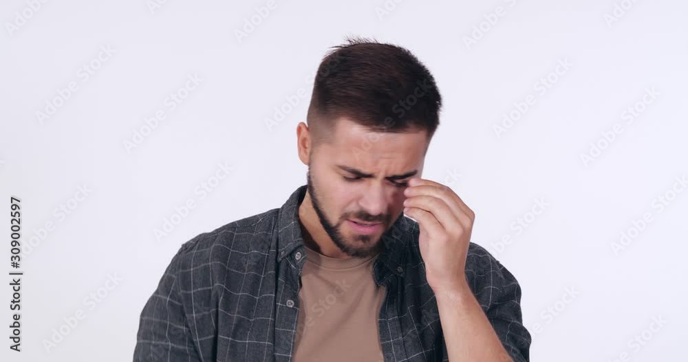 Upset handsome young man on white background Upset handsome young man on white background