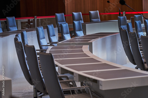 Fotografie Empty row of chairs with work tables in the plenum of the Lower Saxony Parliamen