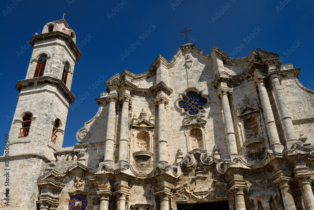 Front of the Havana Cathedral and clock tower made of coral stone