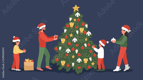 Family decorating Christmas tree. Mother, father and children wearing in Santa hats decorate Christmas tree at home.