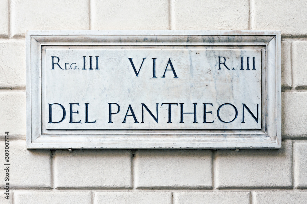 Typical marble street name sign on building wall in Rome, Italy Typical marble street name sign on building wall in Rome, Italy