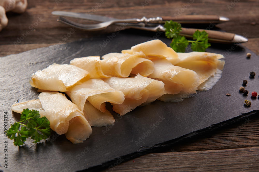 Delicious smoked halibut slices close up Delicious smoked halibut slices close up