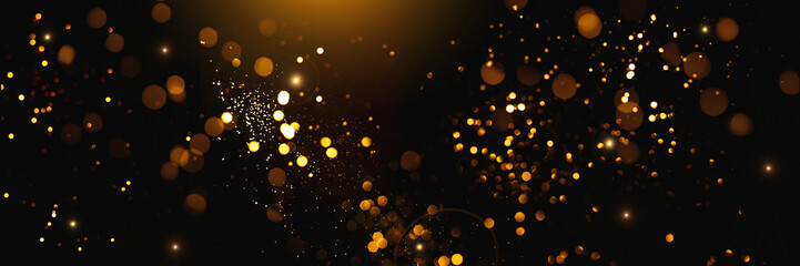 Golden abstract bokeh on black background. Holiday concept