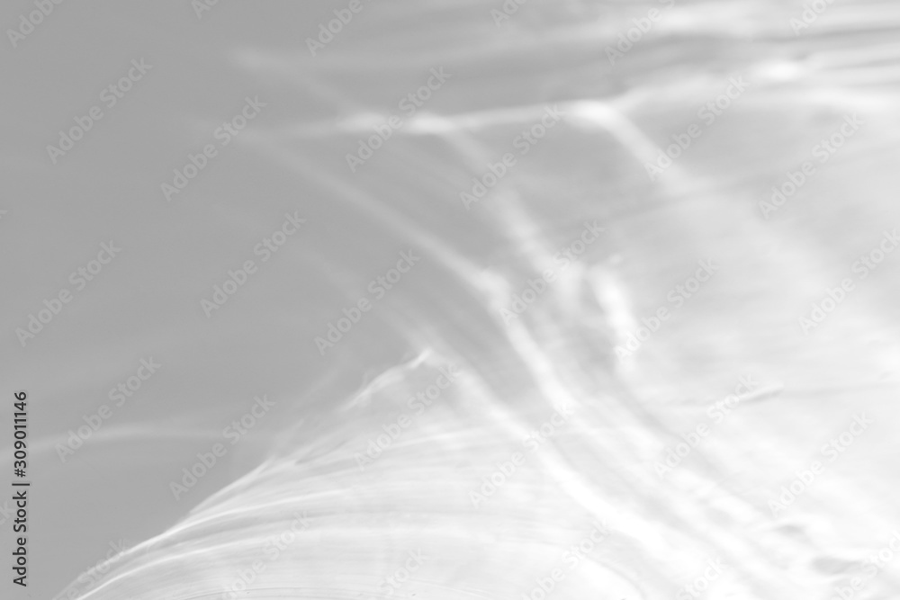 Fototapeta premium Water texture overlay effect for photo and mockups. Organic drop diagonal shadow and light caustic effect on a white wall. 