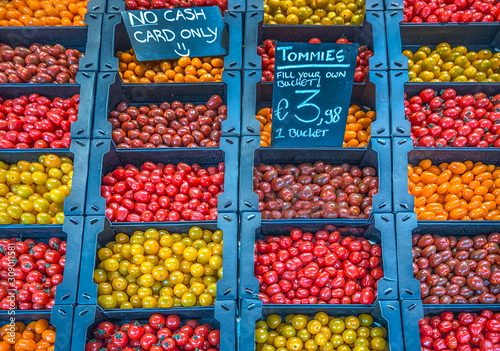 Various different cherry tomatoes offered on a market 