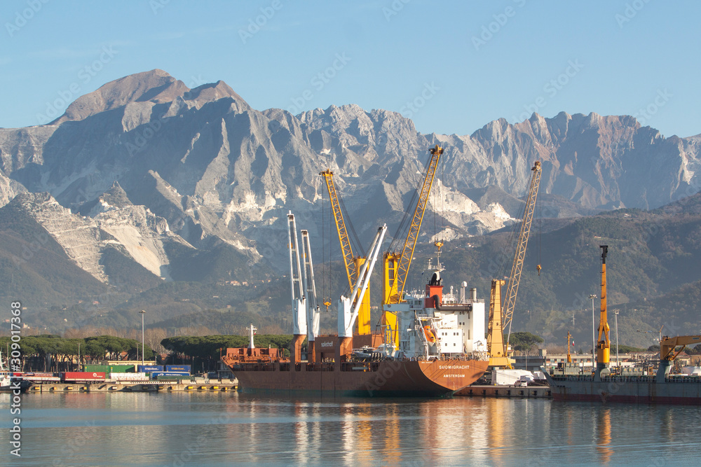 Italy, Tuscany: view of the port in Marina di Carrara and in the background the Apuan Alps with the marble quarries