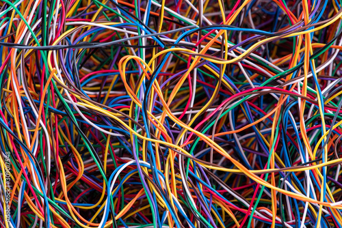 Scrap colorful electrical telecommunication wire close-up, recycling industry