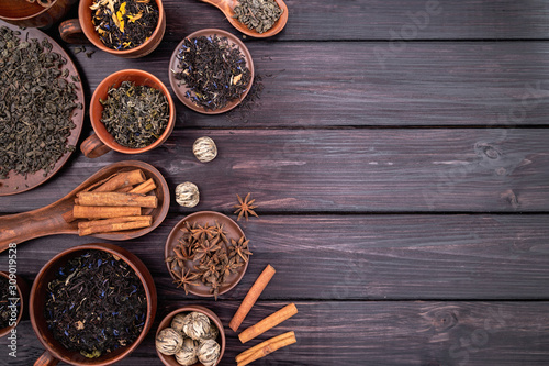 tea and spices on dark wooden background top view flat lay with copy space