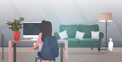 businesswoman sitting at workplace rear view business woman or freelancer using laptop modern living room or office interior portrait horizontal vector illustration