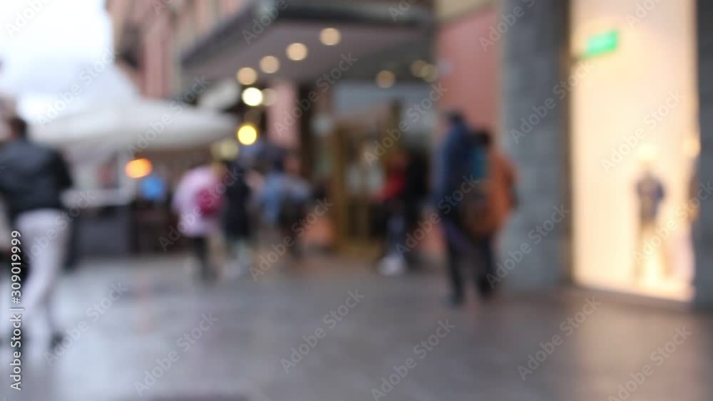 BOLOGNA, ITALY - 22 May 2019: People walking in the street with umbrella during a rainy day. Blurry HD Video BOLOGNA, ITALY - 22 May 2019: People walking in the street with umbrella during a rainy day. Blurry HD Video