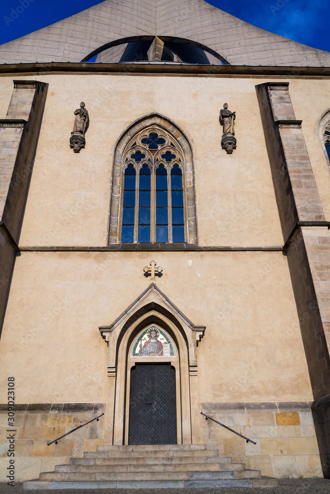 Fototapeta premium Emmaus monastery Na Slovanech, Abbey Church of the Blessed Virgin Mary, St. Jerome and Slavic Saints entrance architectural detail, sunny day, Prague, Czech Republic