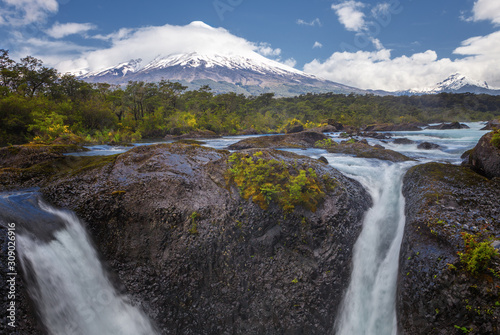 Landscape of the Osorno volcano with the Petrohue waterfalls and river in the foreground in the lake district near Puerto Varas and Puerto Montt  Chile.