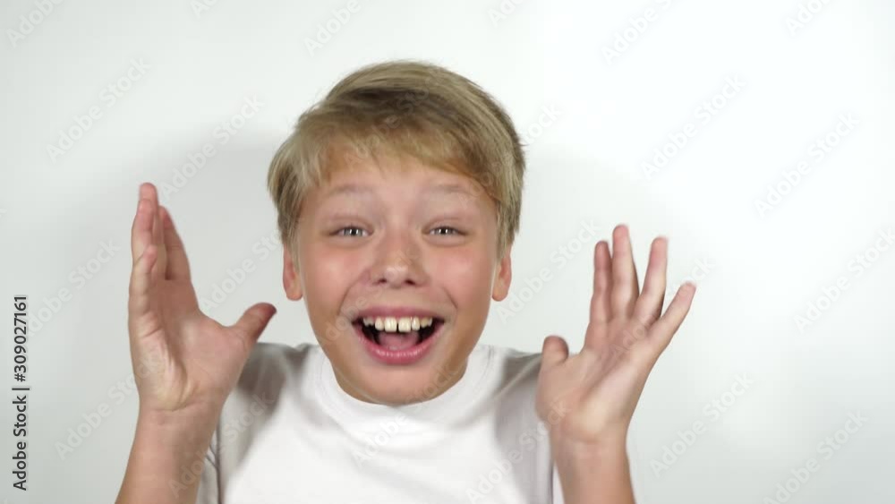 Closeup portrait of happy surprised kid with bright positive emotions. Great news concept. Real time 4k video footage. Closeup portrait of happy surprised kid with bright positive emotions. Great news concept. Real time 4k video footage.