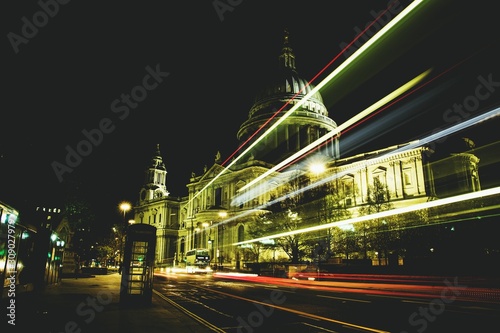 Night view of traffic light trails passing in front of St Paul's Cathedral, London, England