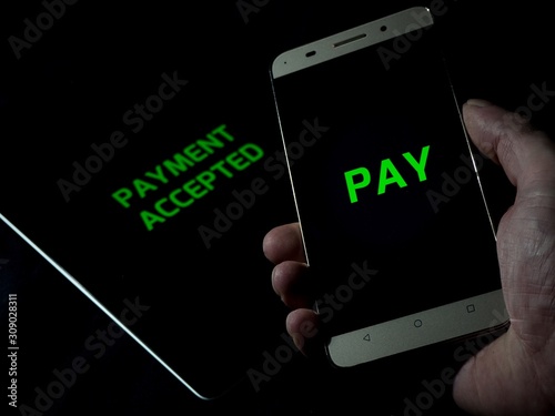 Contactless payment between smartphone and tablet pay cashless - payment accepted