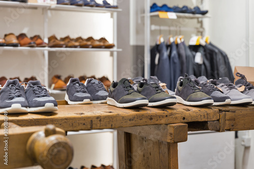 фотографія Display of shoes in modern men's clothing store