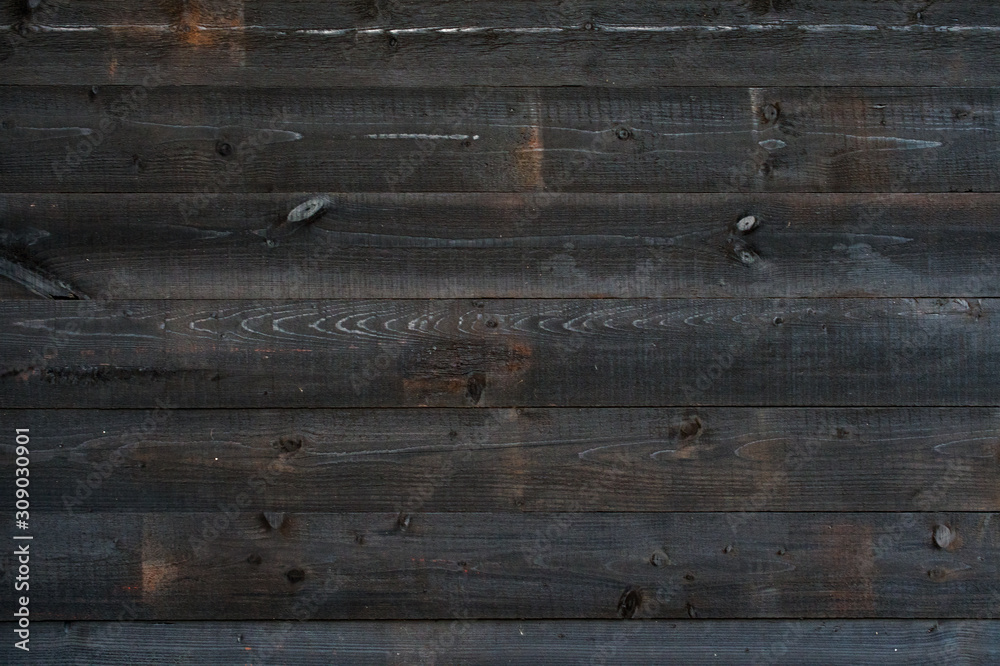 Old dark wooden plank texture background, with horizontal boards. Old dark wooden plank texture background, with horizontal boards.