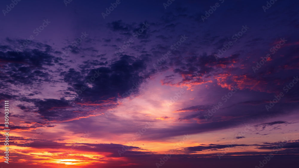 Dramatic cloudscape at sunrise over ocean - obrazy, fototapety, plakaty 