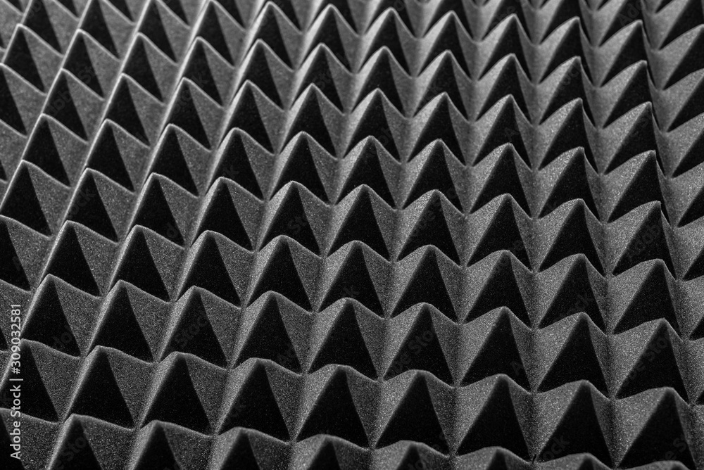 Abstract background in the form of pyramids and dragon scales. Acoustic black foam rubber. Abstract background in the form of pyramids and dragon scales. Acoustic black foam rubber.
