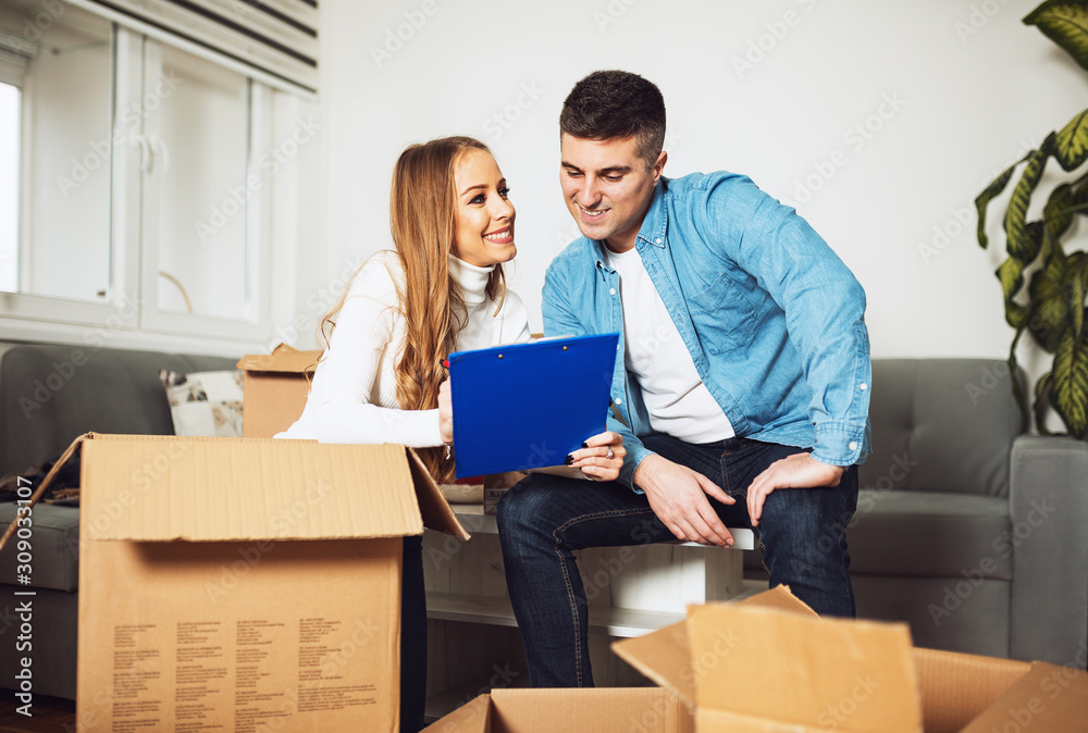Happy couple moving in new home Happy couple moving in new home