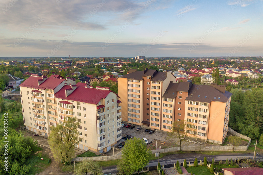 Aerial view of multistory apartment buildings in green residential area. Aerial view of multistory apartment buildings in green residential area.
