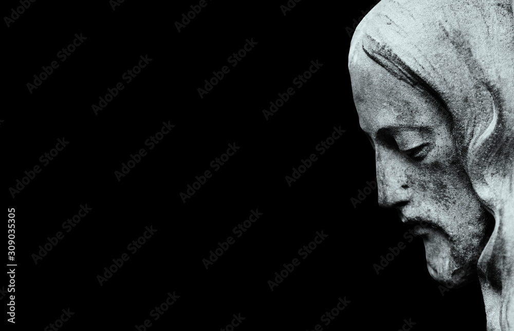 Profil of Jesus Christ isolated on black background. (ancient statue) Profil of Jesus Christ isolated on black background. (ancient statue)