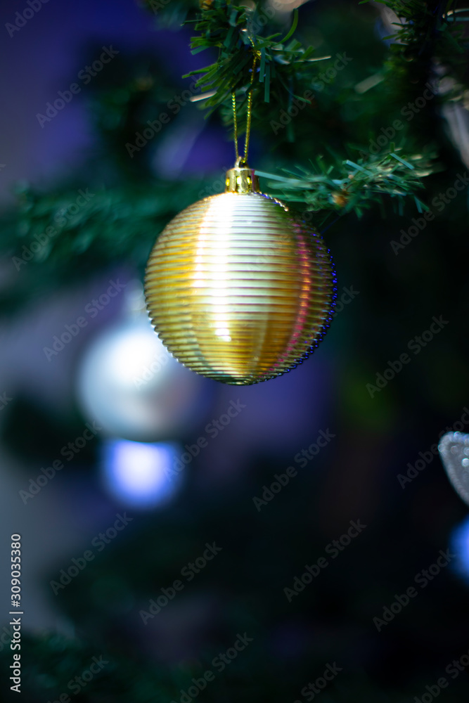 Fototapeta premium Yellow Christmas decoration ball