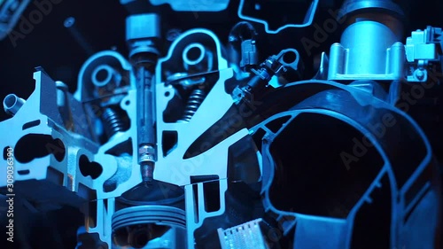 A closeup of a cutaway internal combustion engine. photo