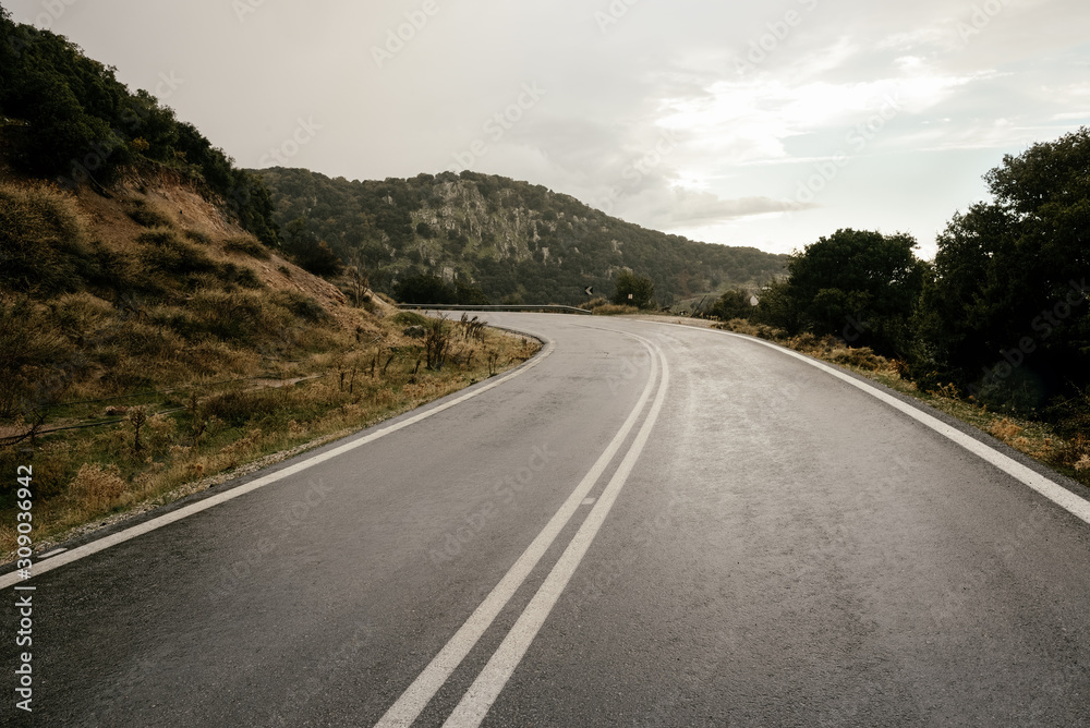 Cinematic road landscape. Lesbos Island, Greece. Misty road