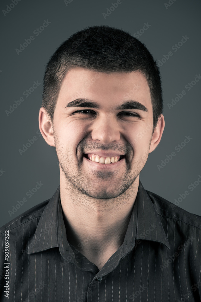 Fototapeta premium Close-up portrait of a young emotional man