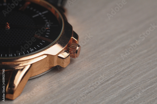Close up macro watch on grey wooden board (ID: 309037961)