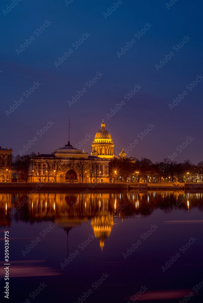 Admiralty embankment with its historical buildings and the Neva river with reflections