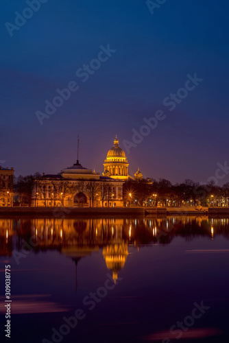 Admiralty embankment with its historical buildings and the Neva river with reflections