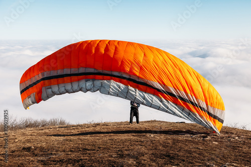 paraglider preparing to jump