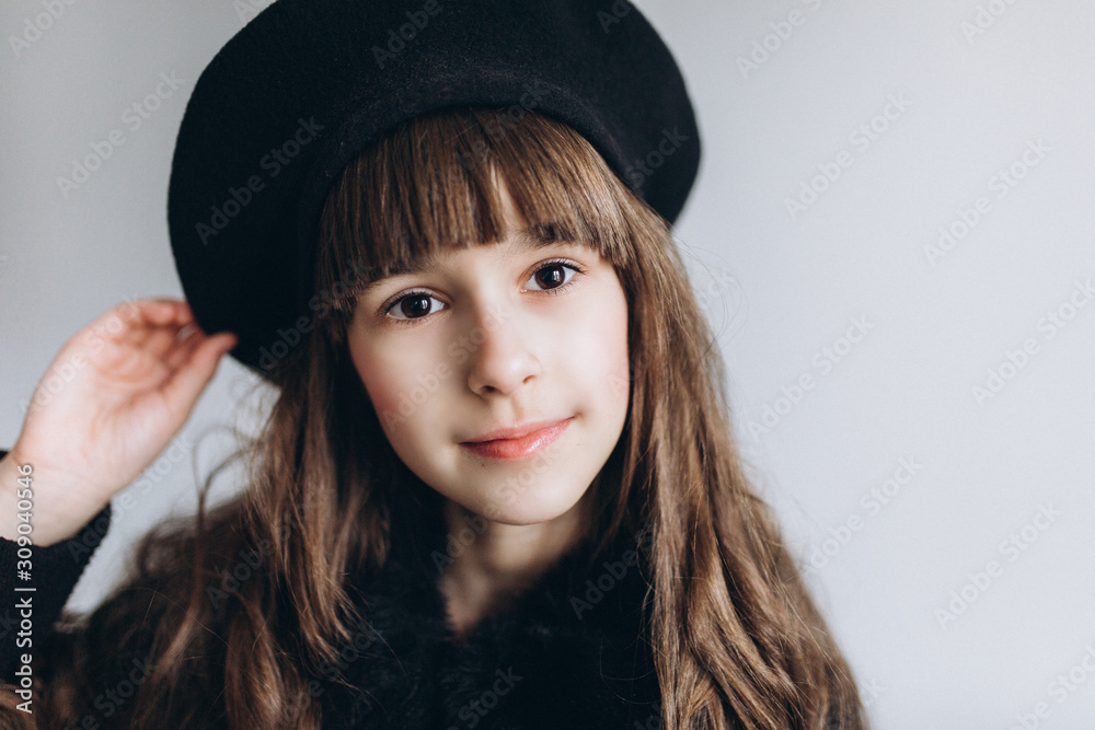 Close up portrait of little cute adorable girl posing alone on isolated white background in studio. Childhood, fashion kids, baby model concept Close up portrait of little cute adorable girl posing alone on isolated white background in studio. Childhood, fashion kids, baby model concept