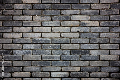 Texture of wet gray brick wall
