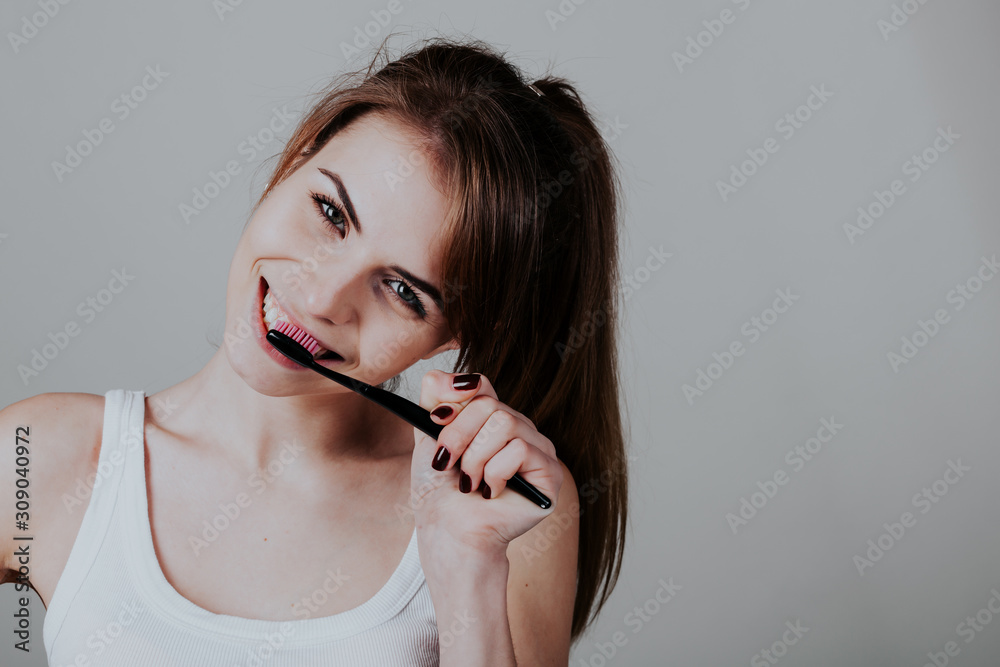 pretty girl in the bathroom brushing his teeth smile pretty girl in the bathroom brushing his teeth smile