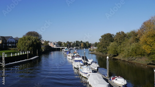 Boats Moored up on the River Thames in Teddington London Uk photo