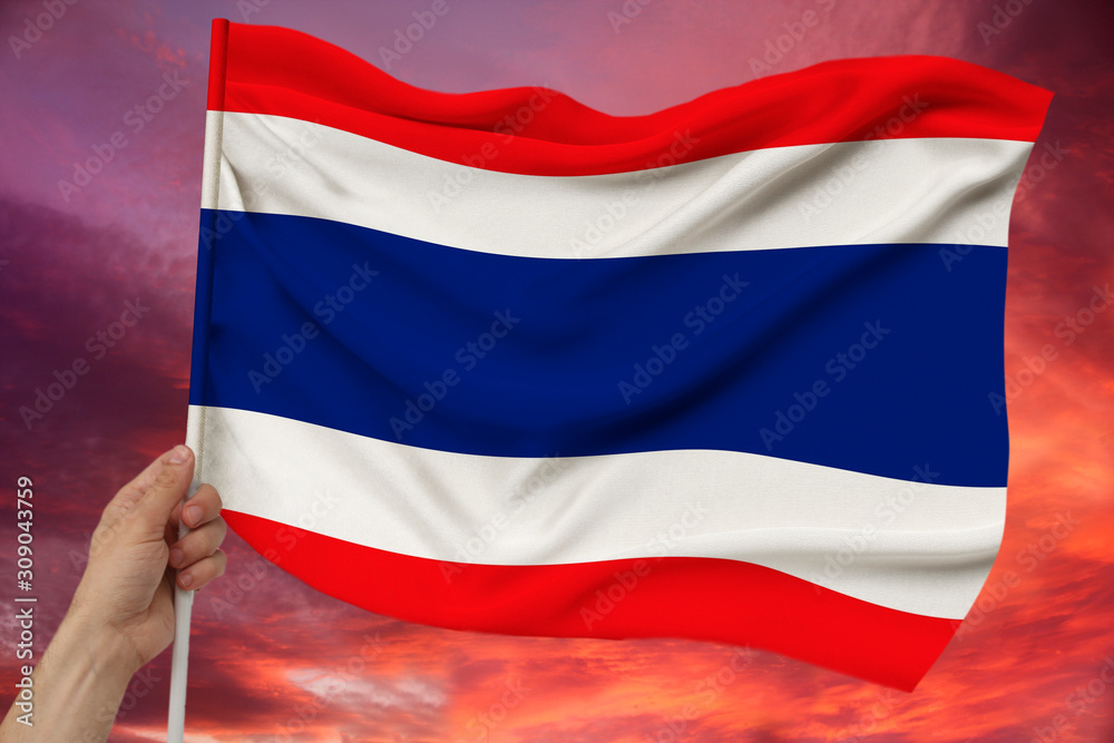 Fototapeta premium photo of the beautiful colored national flag of the modern state of Thailand on textured fabric, concept of tourism, emigration, economics and politics, closeup