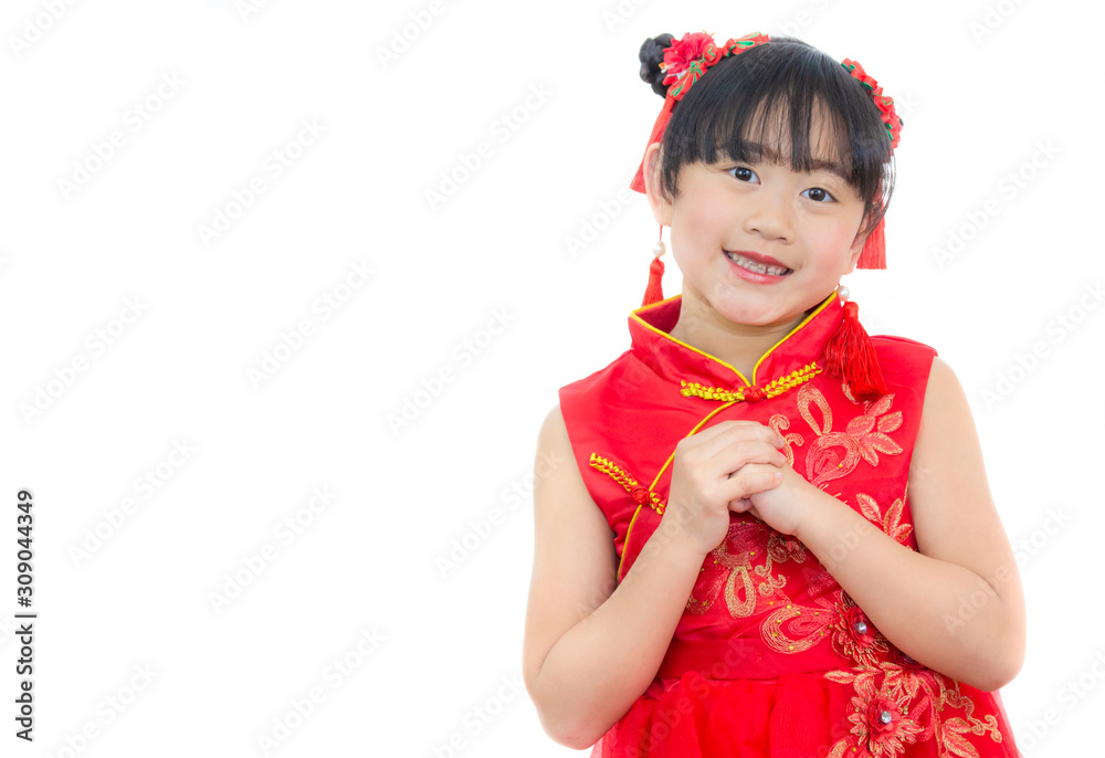 A picture of an Asian girl wearing a red Chinese dress in a white background. Concept Chinese new year for the love day and is a tradition in China every year. A picture of an Asian girl wearing a red Chinese dress in a white background. Concept Chinese new year for the love day and is a tradition in China every year.