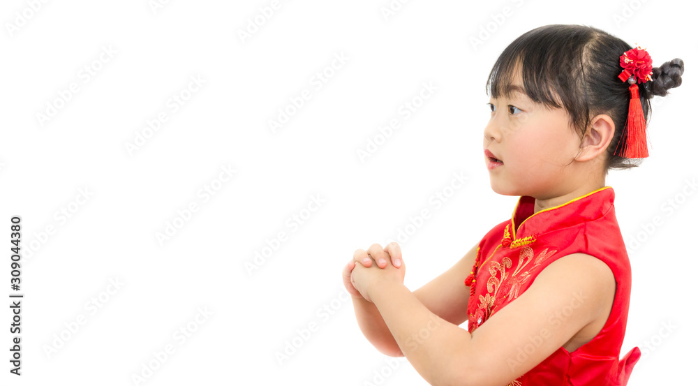 A picture of an Asian girl wearing a red Chinese dress in a white background. Concept Chinese new year for the love day and is a tradition in China every year. A picture of an Asian girl wearing a red Chinese dress in a white background. Concept Chinese new year for the love day and is a tradition in China every year.