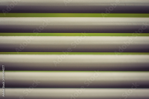 Closeup of White Blind with Green Background