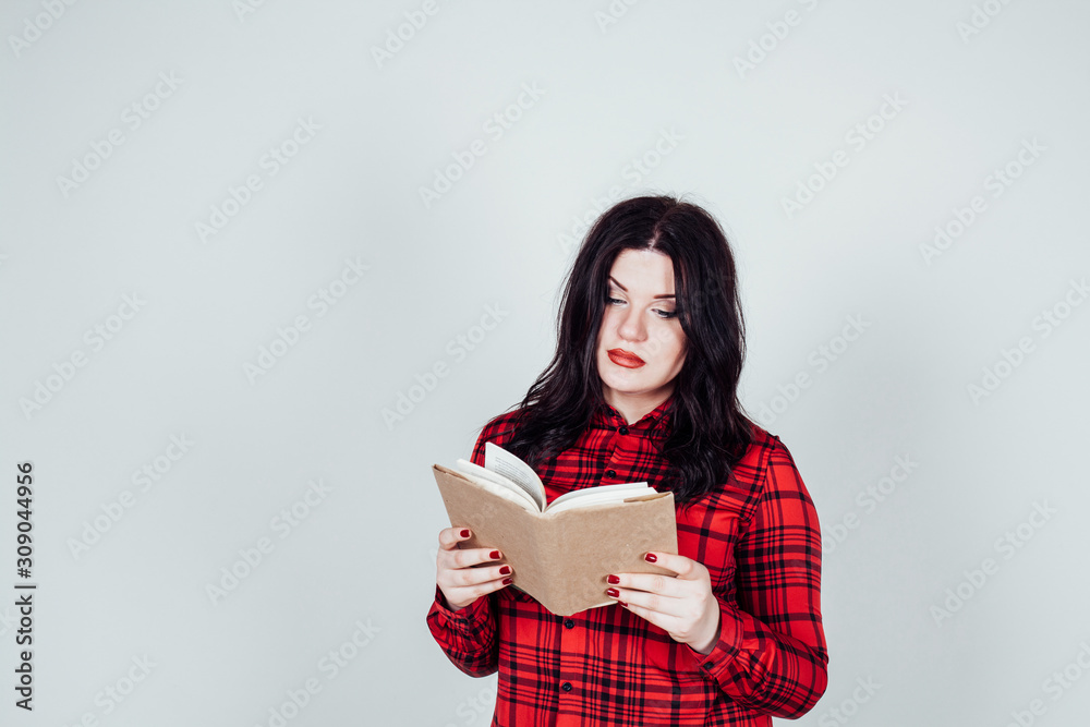 fat girl in a red shirt reads a book fat girl in a red shirt reads a book