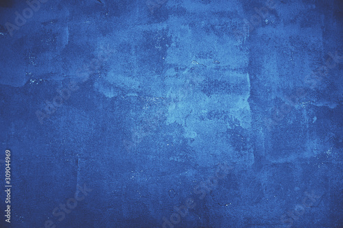 Beautiful abstract classic blue grunge decorative navy dark wall background. Art rough stylized texture banner With space for text. Grunge classic blue texture.