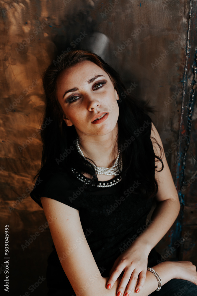 Portrait of a girl with green eyes in black clothing Portrait of a girl with green eyes in black clothing